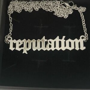 Taylor Swifts Reputation. Silver Reputation necklace memorabilia. Very shiny